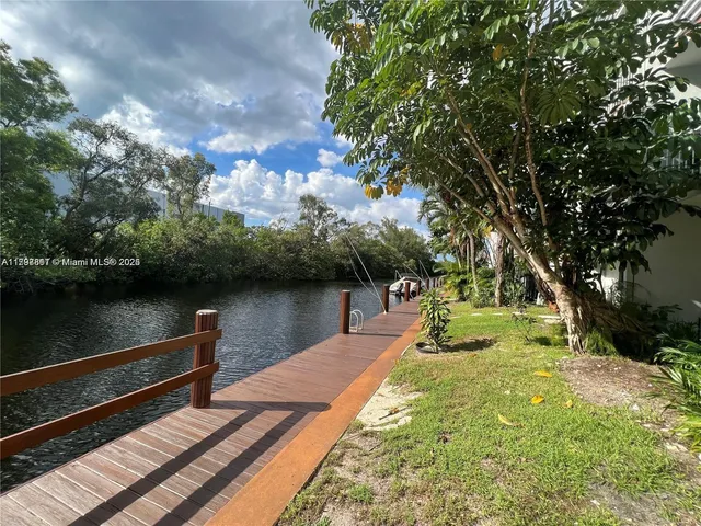 a view of a lake with a yard