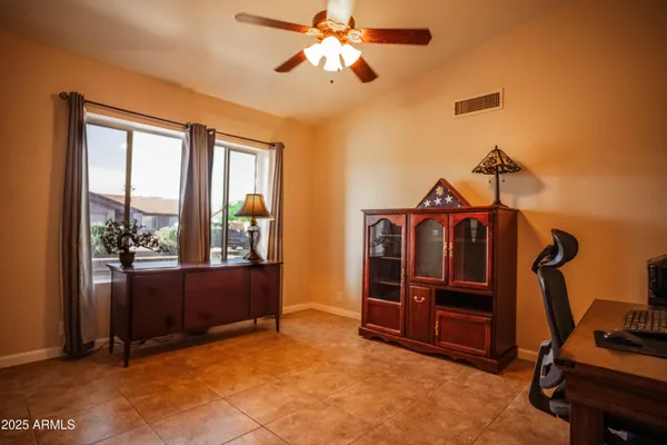 a view of workspace with furniture and window