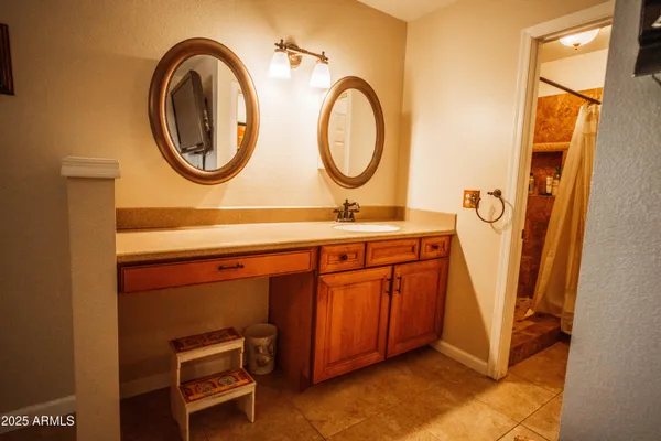 a bathroom with a sink and a mirror