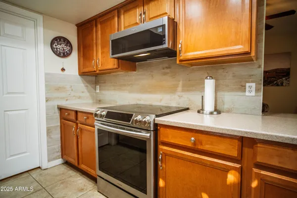 a kitchen with a stove and a microwave