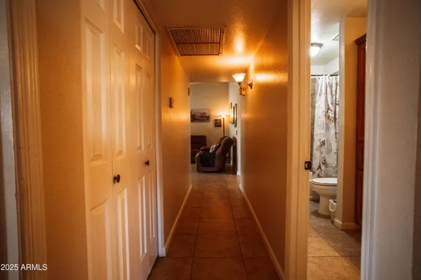 a view of a bathroom from the hallway