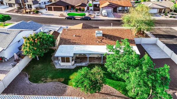 an aerial view of a house with a garden and plants