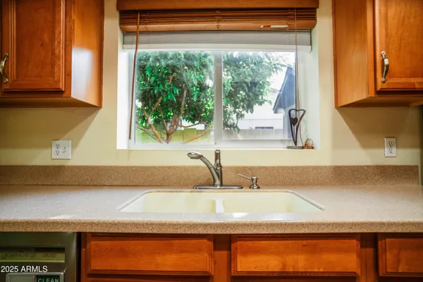 a bathroom with a sink and a window