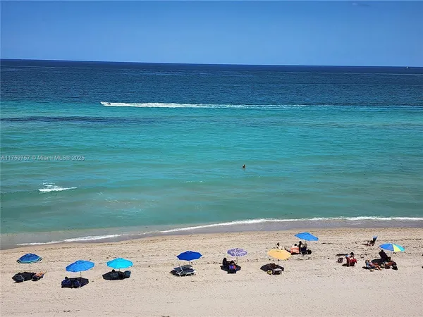 a view of a swimming pool and an ocean view