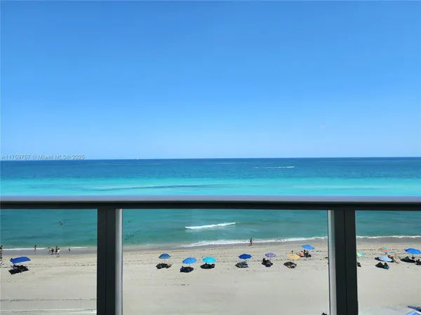 a kitchen with a refrigerator and a sink