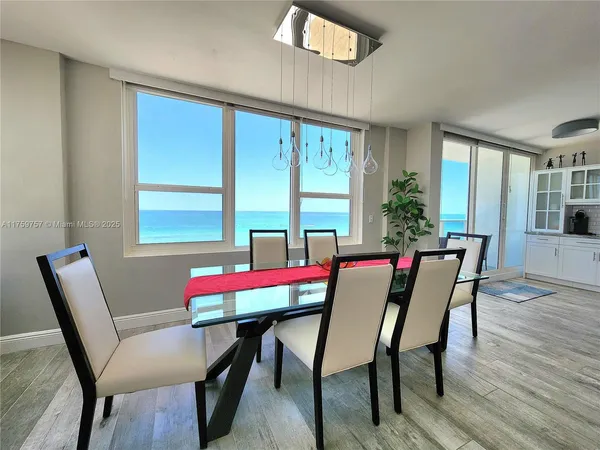 a living room with furniture window and a flat screen tv