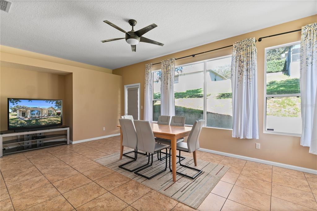 13320 Via Roma Circle Clermont, FL 34711 - Photo 11 of 26 a view of a dining room with furniture window and outside view