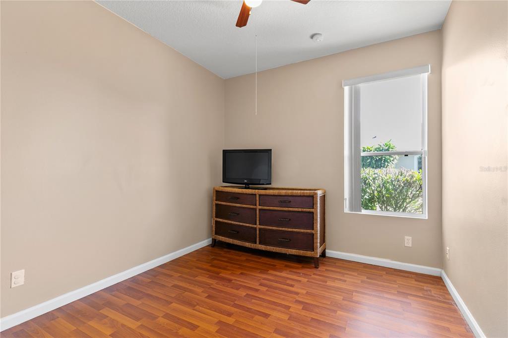 13320 Via Roma Circle Clermont, FL 34711 - Photo 13 of 25 a view of room with hardwood floor and window