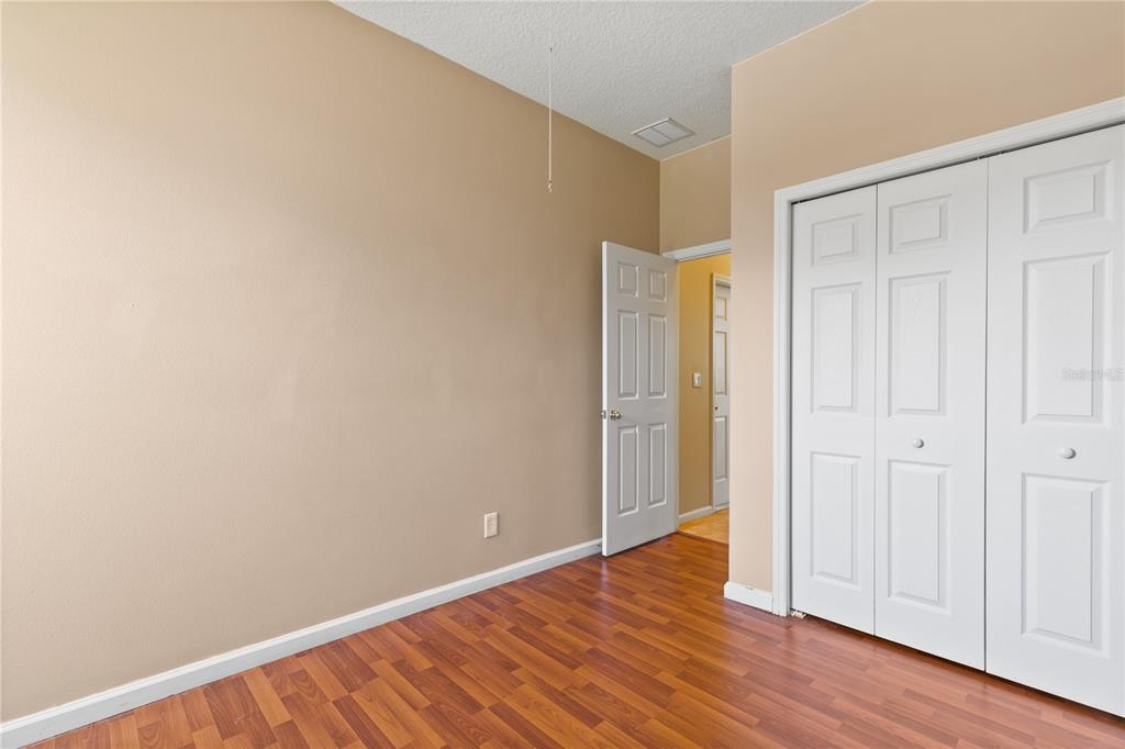 13320 Via Roma Circle Clermont, FL 34711 - Photo 15 of 25 a view of an empty room with wooden floor