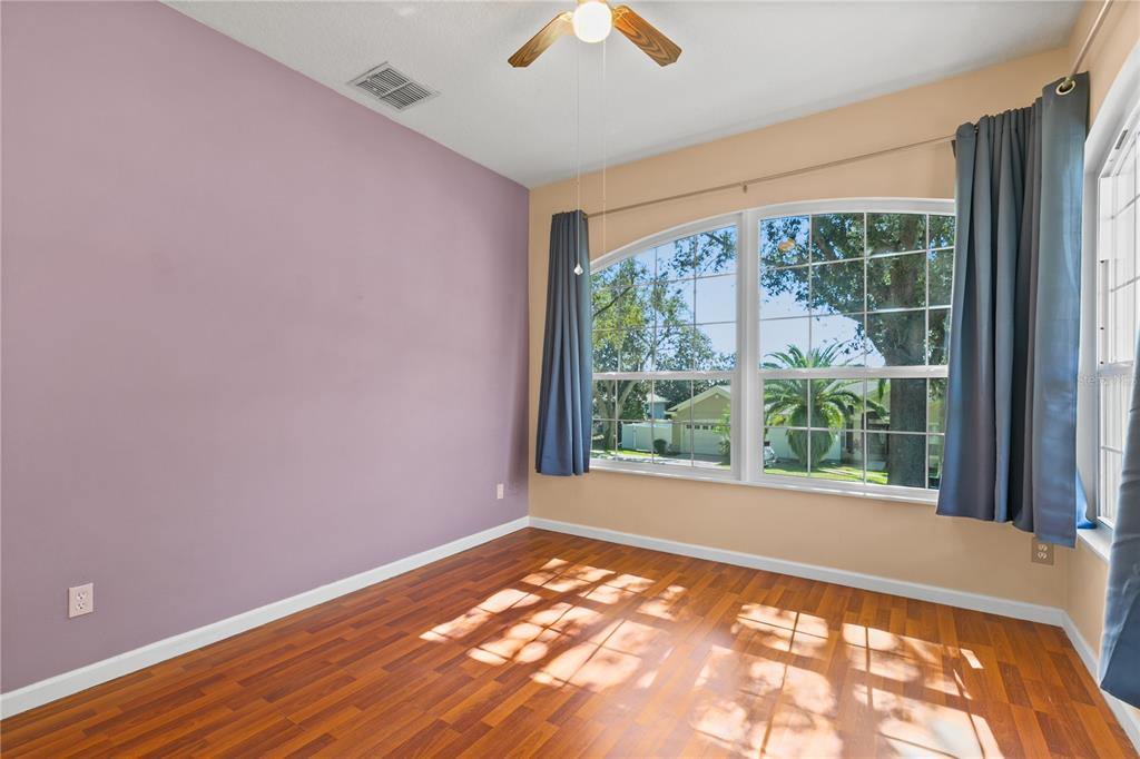 13320 Via Roma Circle Clermont, FL 34711 - Photo 16 of 25 a view of an empty room with a window