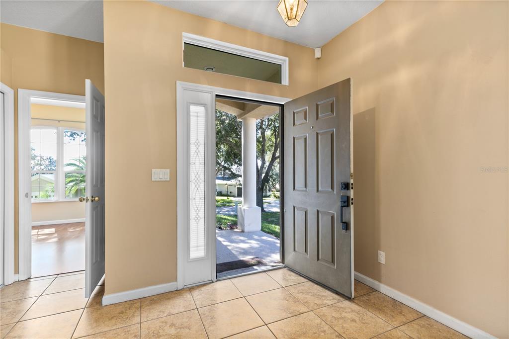 13320 Via Roma Circle Clermont, FL 34711 - Photo 4 of 26 a view of a entryway door and an empty room