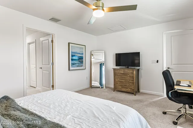 a bathroom with a shower sink and mirror