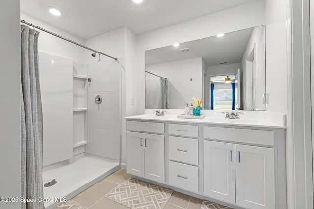 a bathroom with a toilet a sink and view