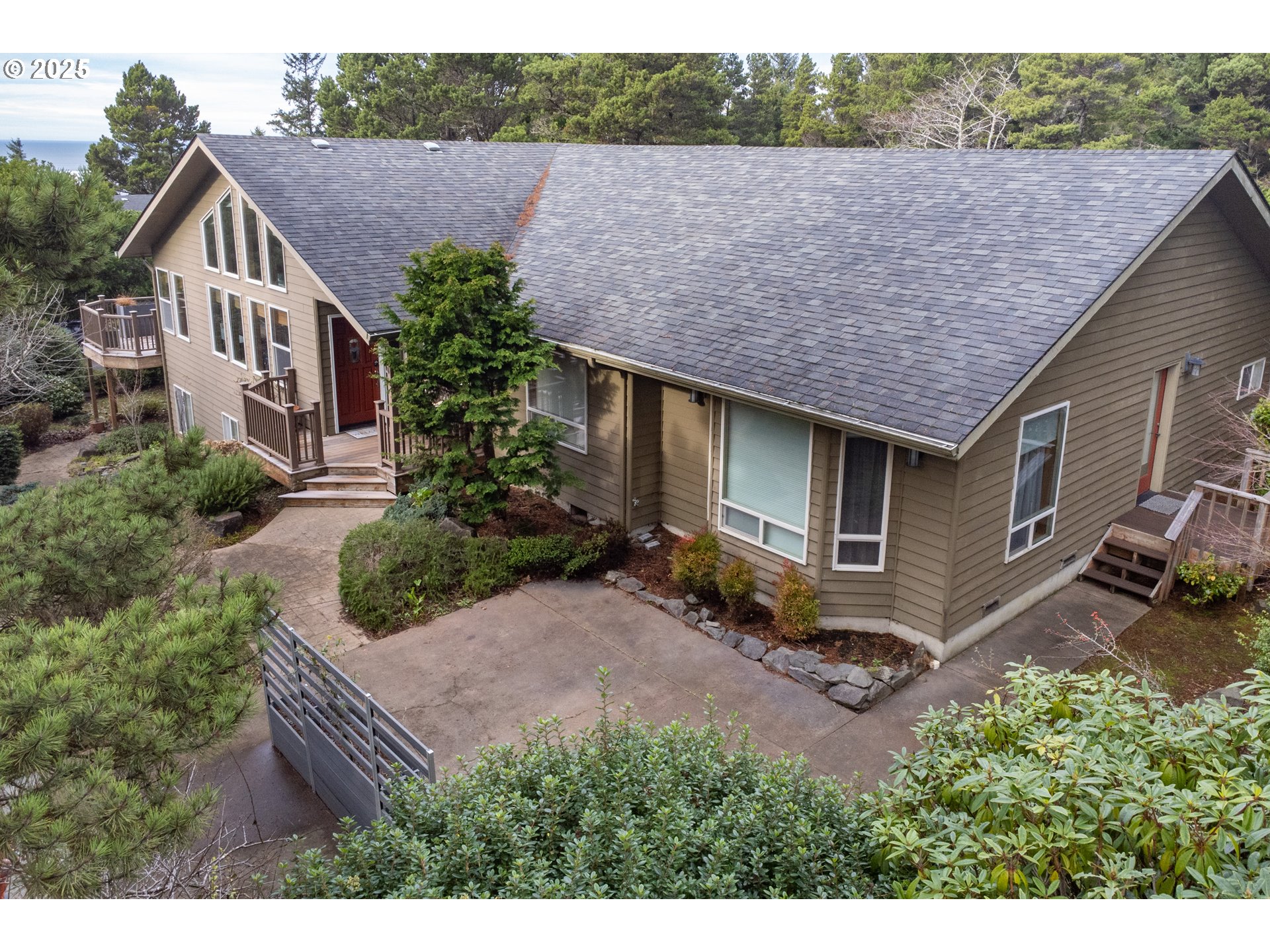 a aerial view of a house with a yard