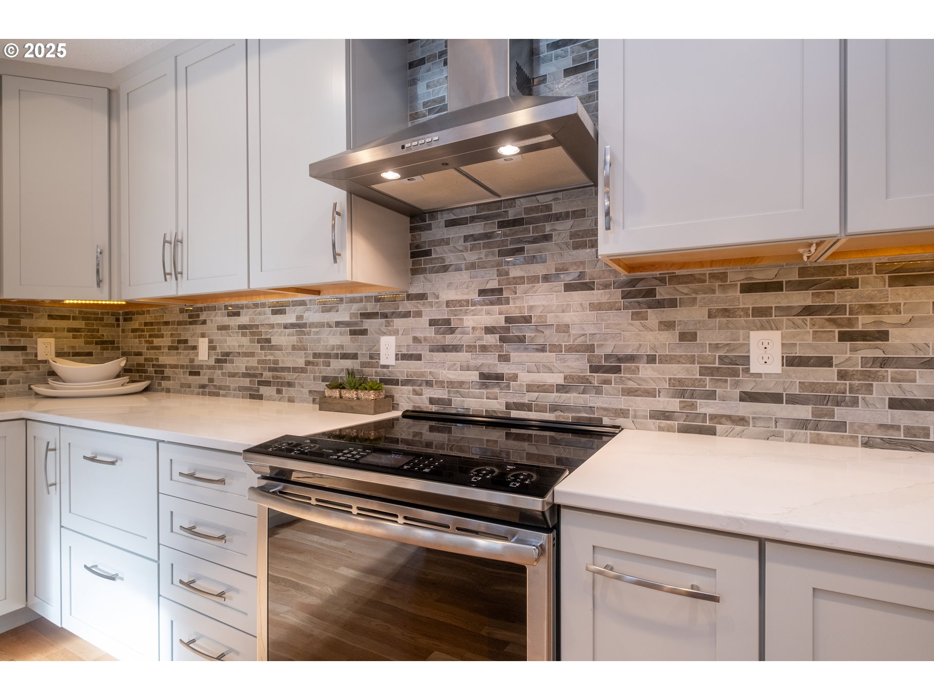 760 Southwest Range Drive Waldport, OR 97394 - Photo 11 of 30 a kitchen with cabinets and appliances