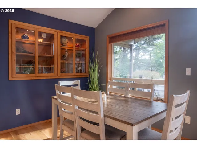 a dining room with a table and chairs