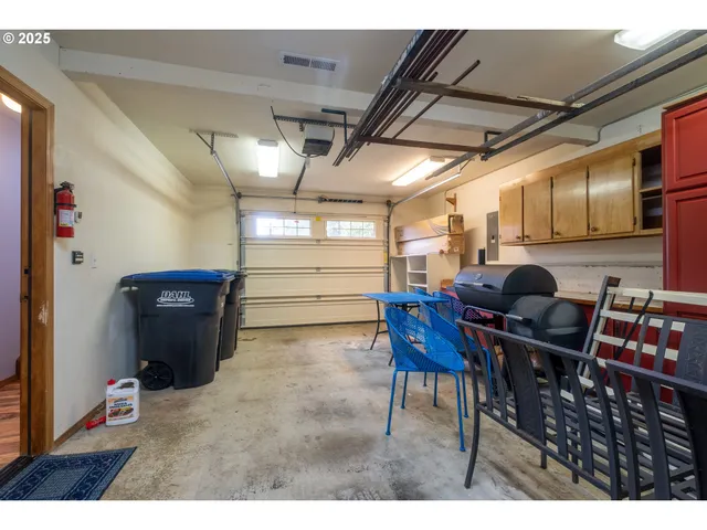 a workspace with furniture and a ceiling fan