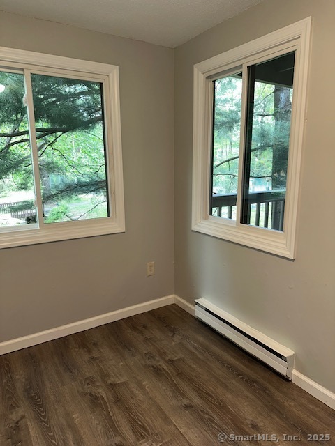 7 Padanaram Road, Unit J232 Danbury, CT 06811 - Photo 8 of 26 a view of a room with wooden floor and a window