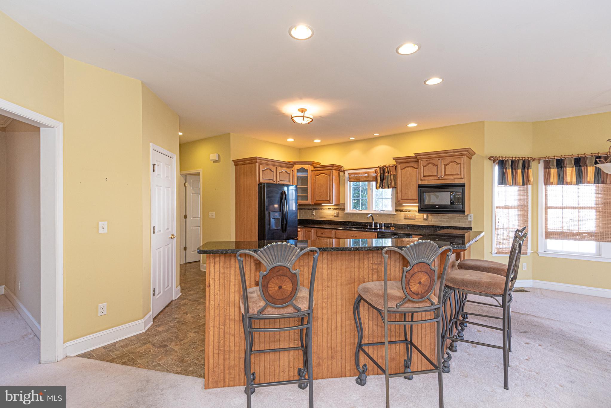 6023 Tarry Town Road Salisbury, MD 21801 - Photo 10 of 61 Inviting kitchen with warm yellow tones.