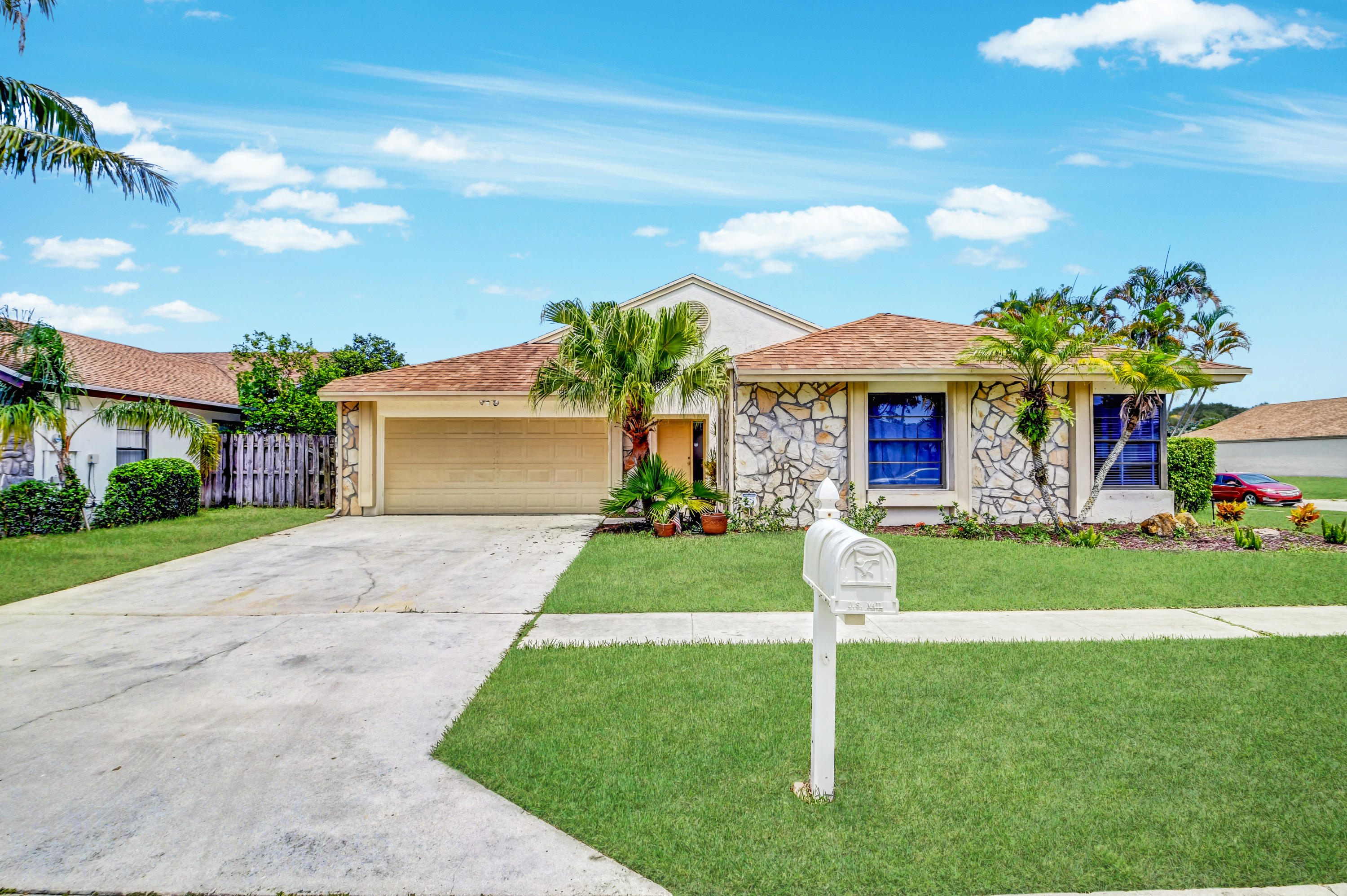 21080 Windemere Lane Boca Raton, FL 33428 - Photo 1 of 97 a front view of a house with a yard and garage