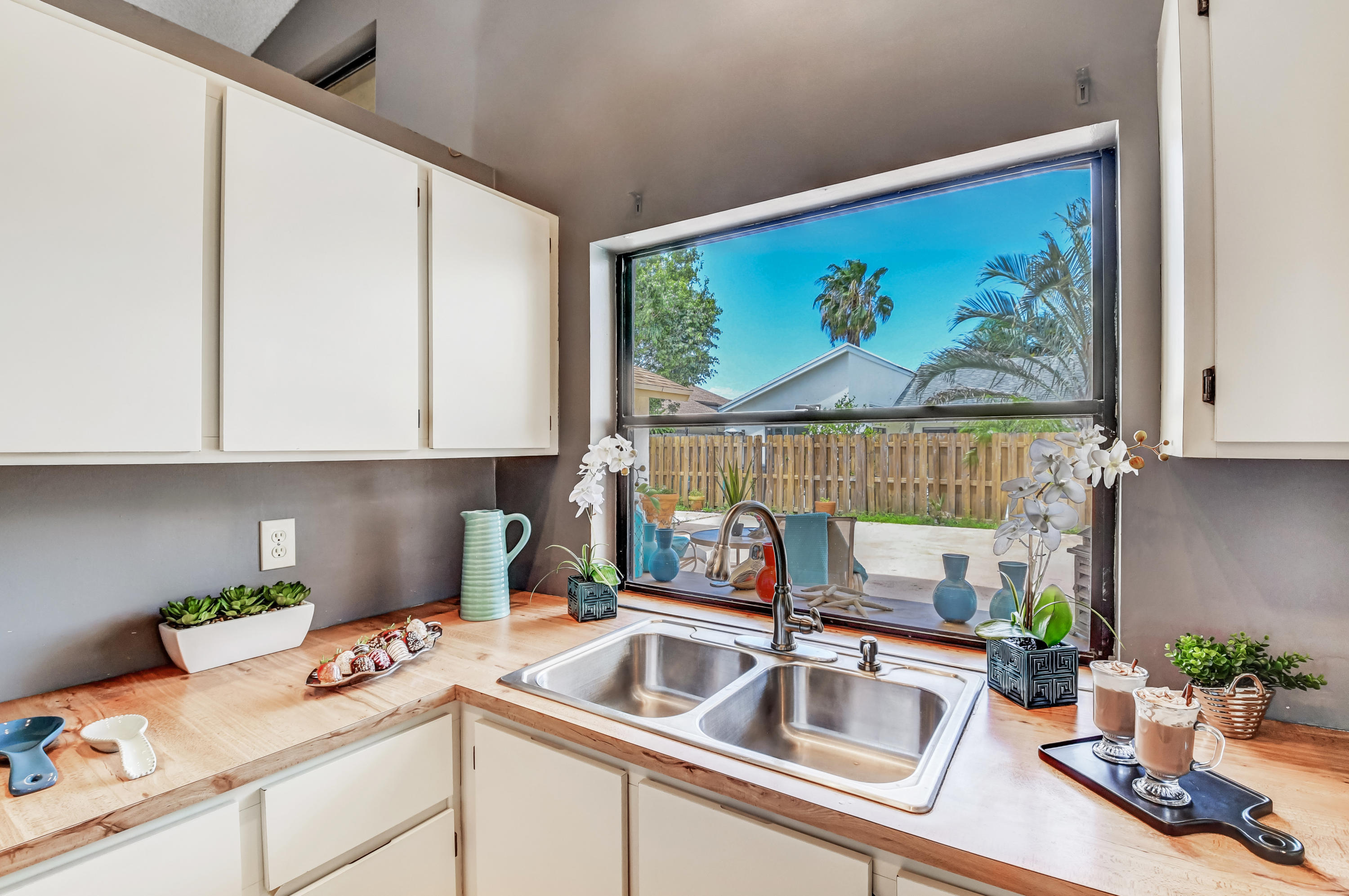 21080 Windemere Lane Boca Raton, FL 33428 - Photo 26 of 97 a kitchen with appliances a sink and cabinets
