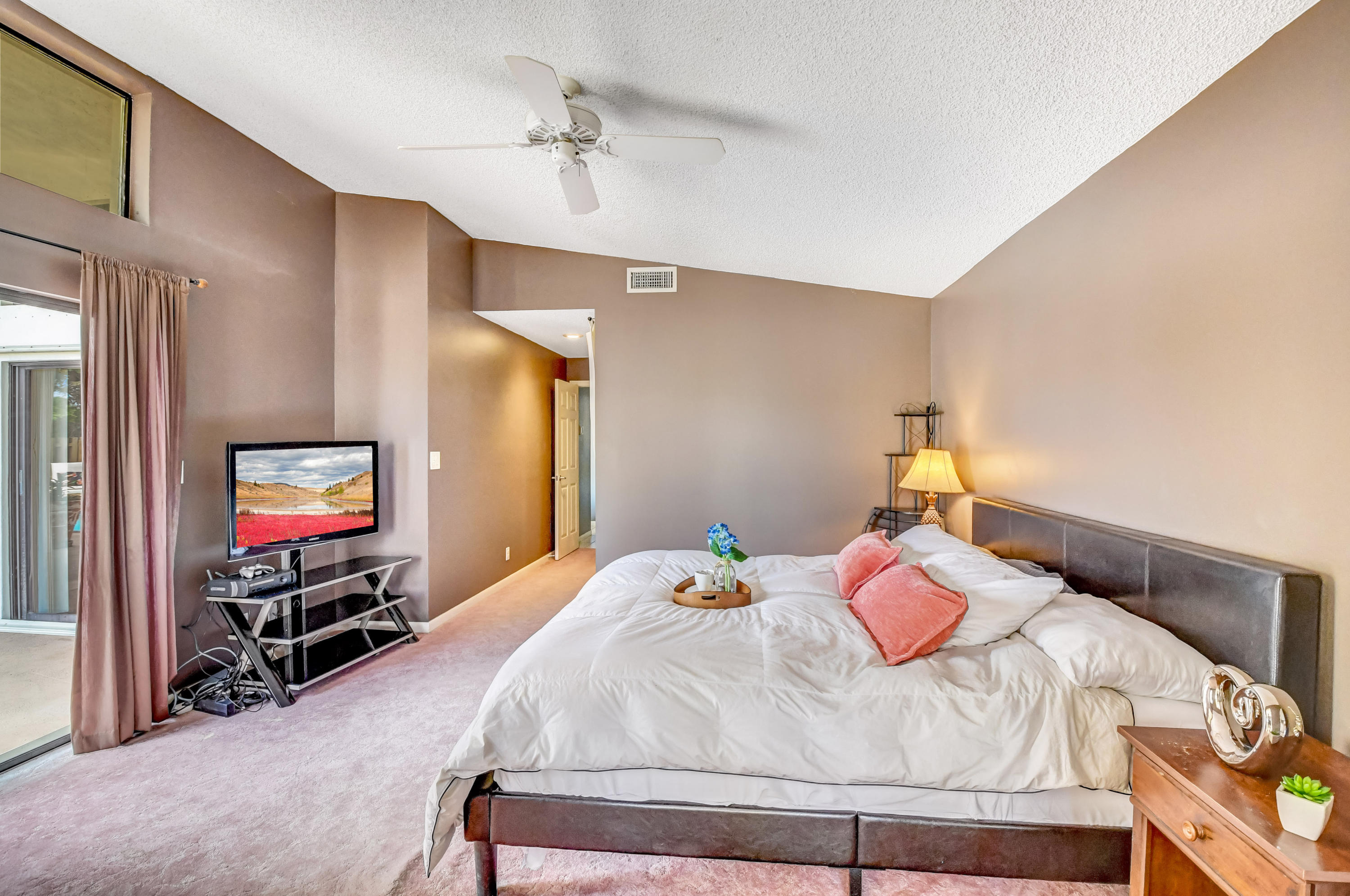 21080 Windemere Lane Boca Raton, FL 33428 - Photo 33 of 97 a bedroom with a bed and a flat screen tv