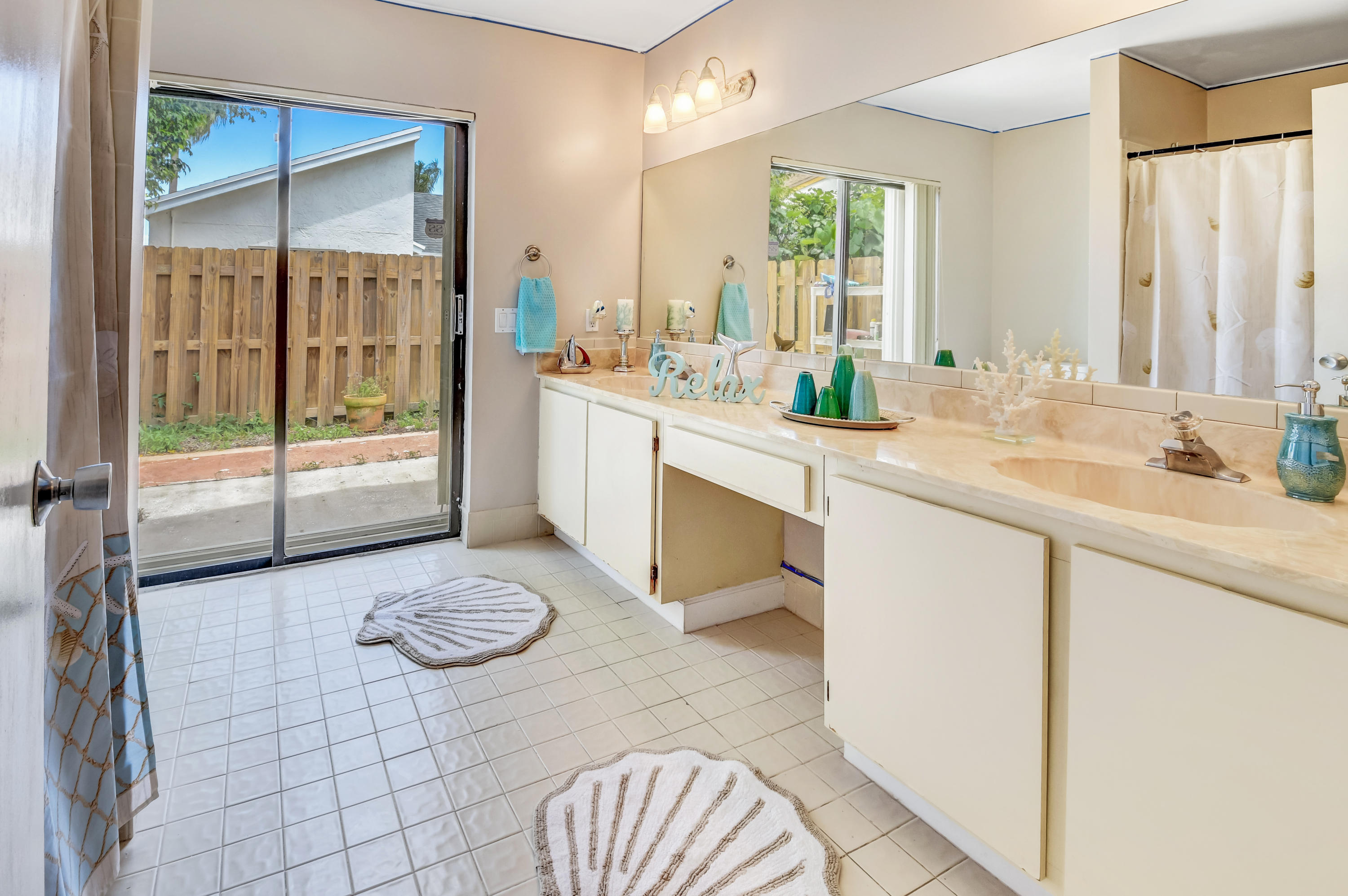 21080 Windemere Lane Boca Raton, FL 33428 - Photo 35 of 97 a spacious bathroom with a double vanity sink a mirror and a shower