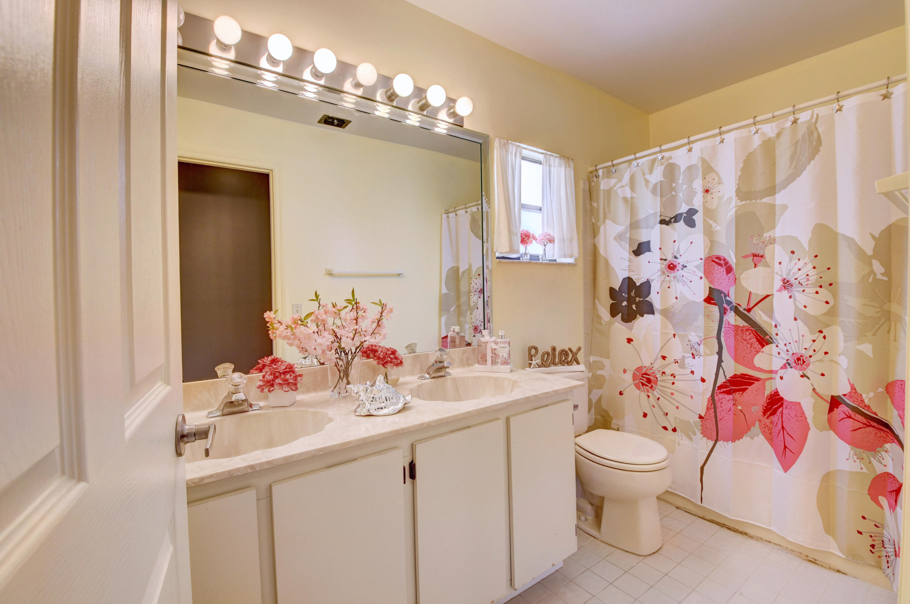 21080 Windemere Lane Boca Raton, FL 33428 - Photo 40 of 97 a bathroom with a sink vanity mirror and toilet