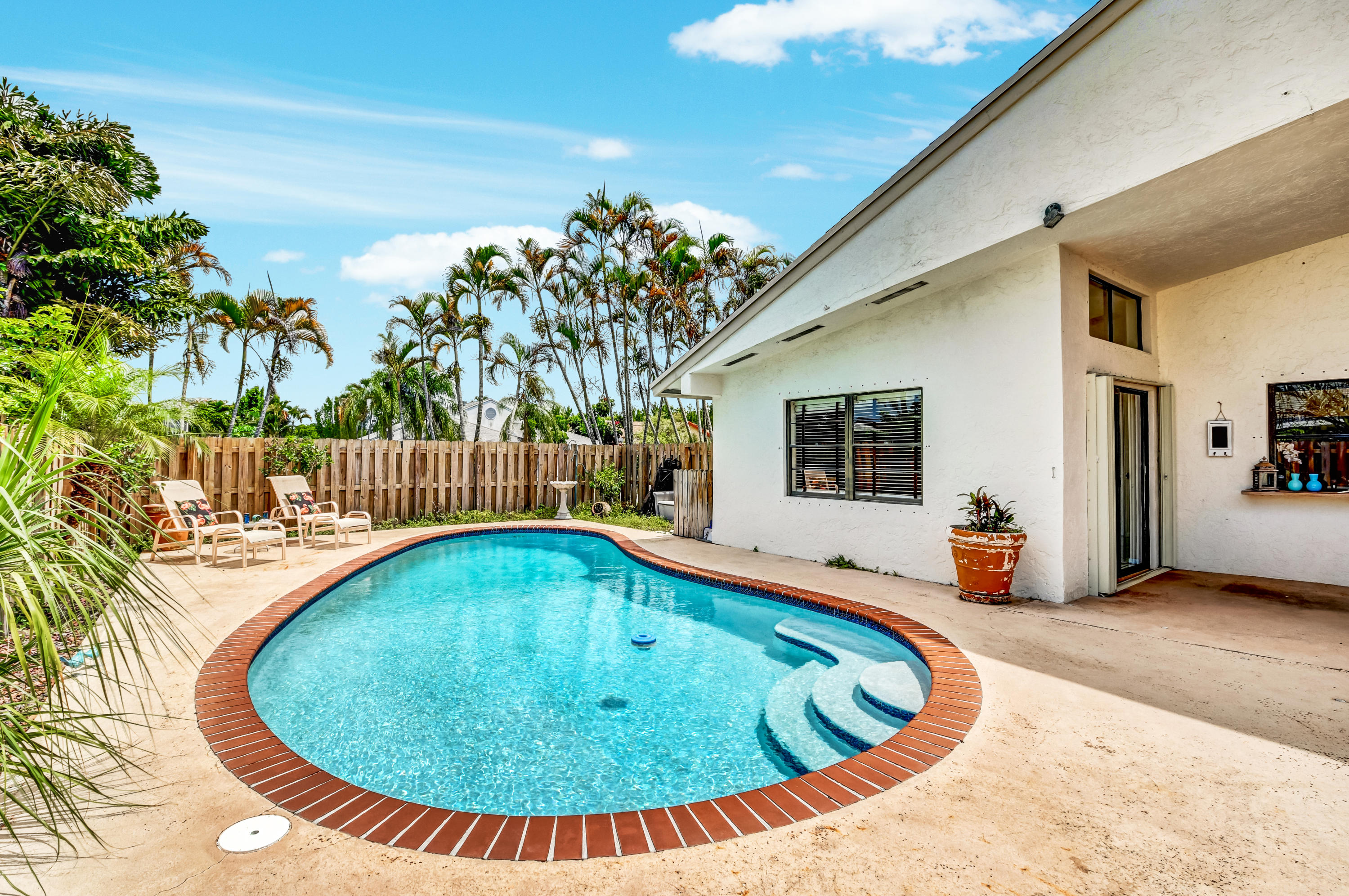 21080 Windemere Lane Boca Raton, FL 33428 - Photo 4 of 97 swimming pool view with a garden space