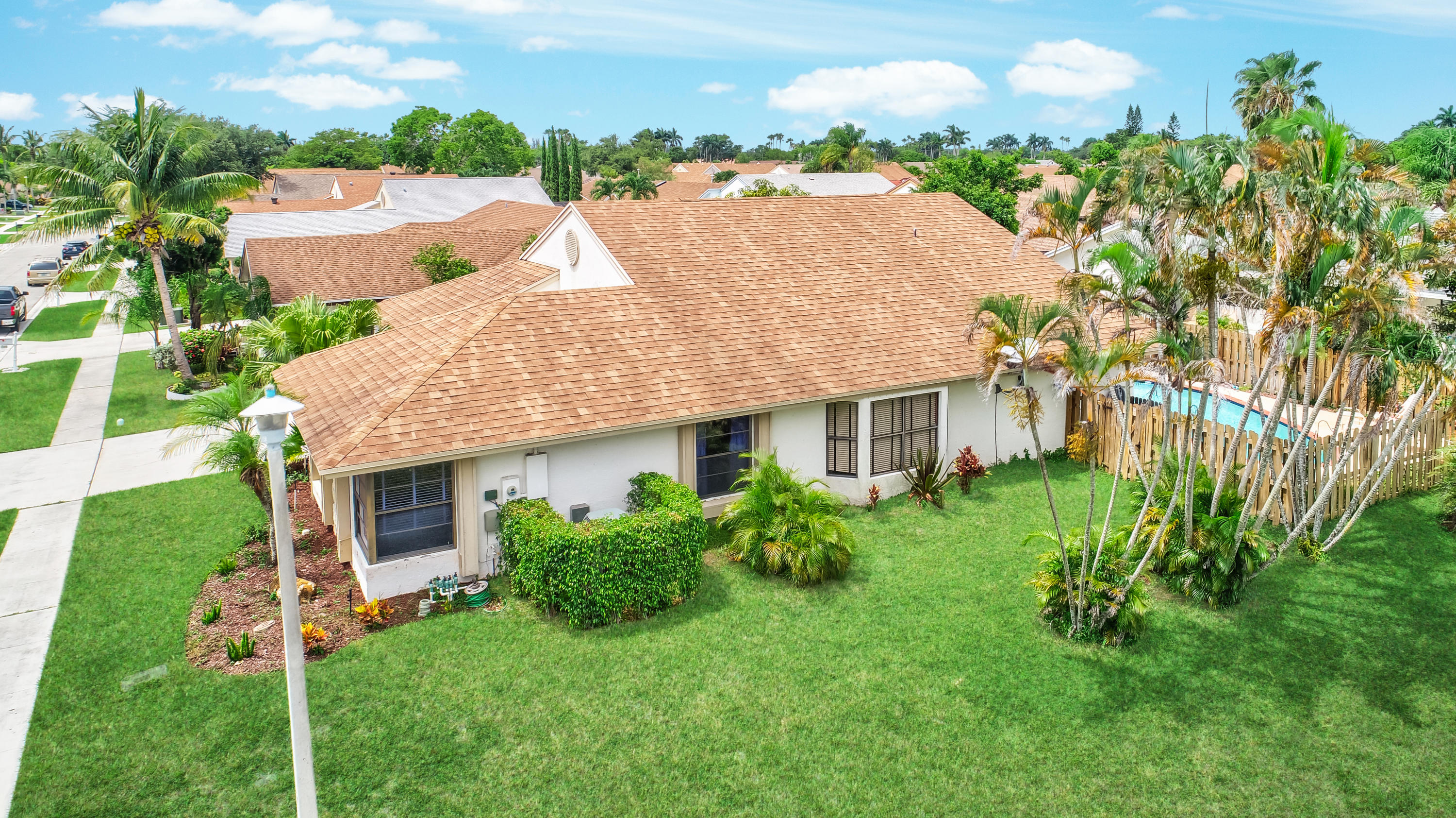 21080 Windemere Lane Boca Raton, FL 33428 - Photo 56 of 97 a front view of a house with a garden