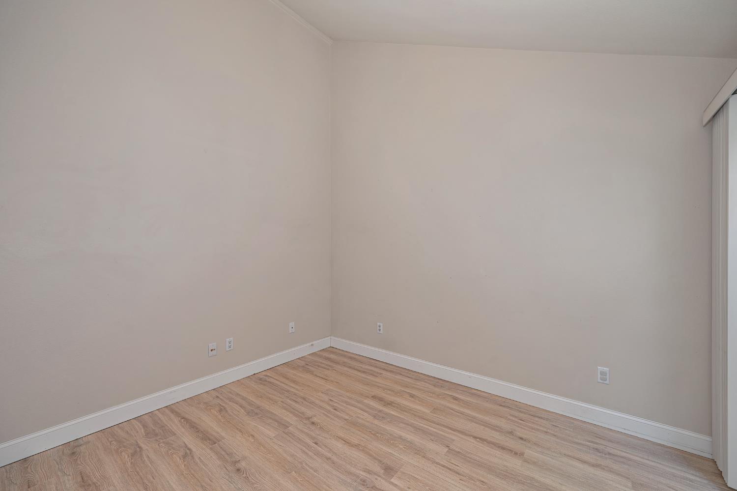 6986 Carreta Lane Rancho Murieta, CA 95683 - Photo 19 of 47 a view of an empty room with wooden floor