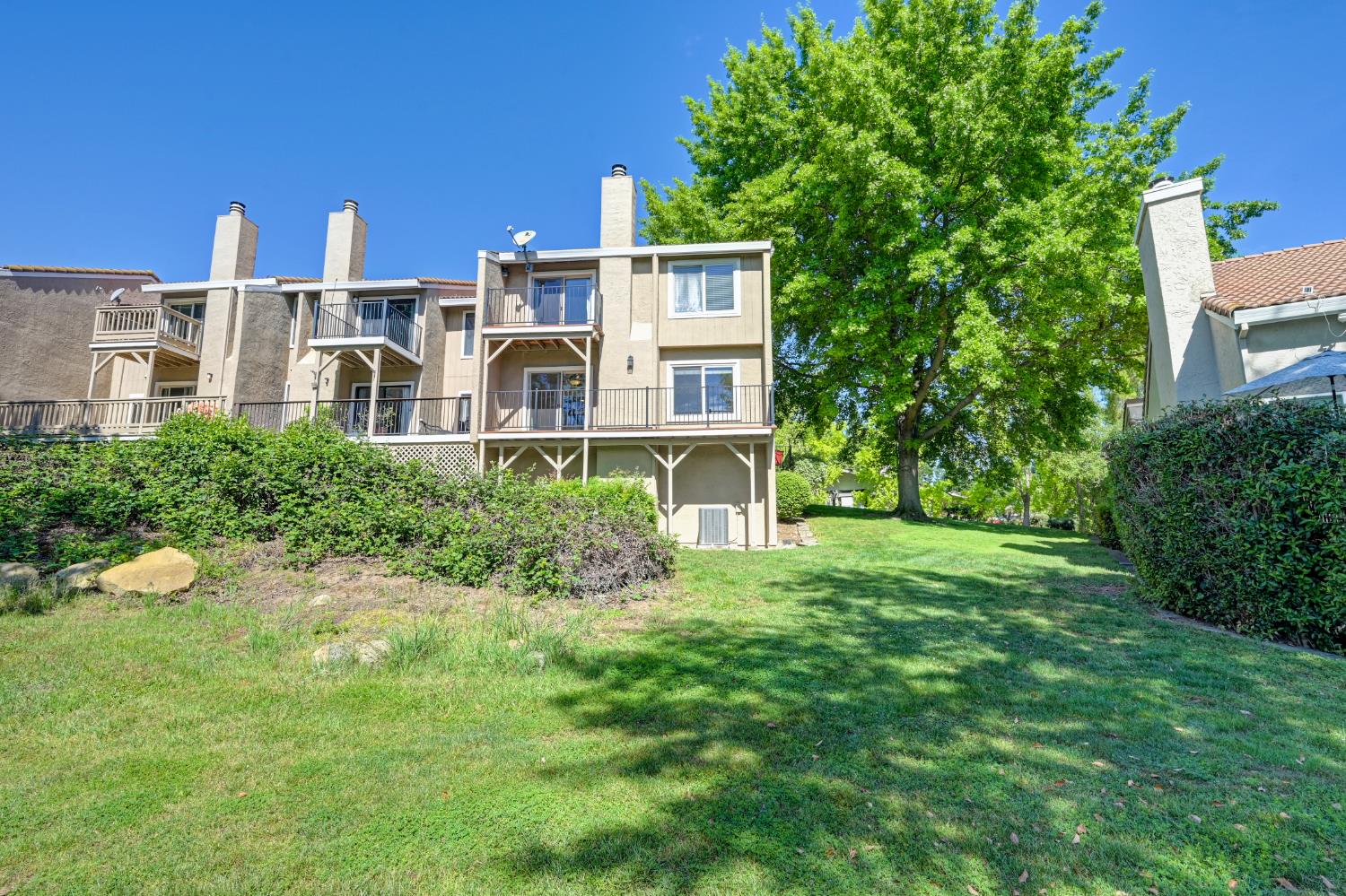 6986 Carreta Lane Rancho Murieta, CA 95683 - Photo 35 of 47 a front view of a house with a yard