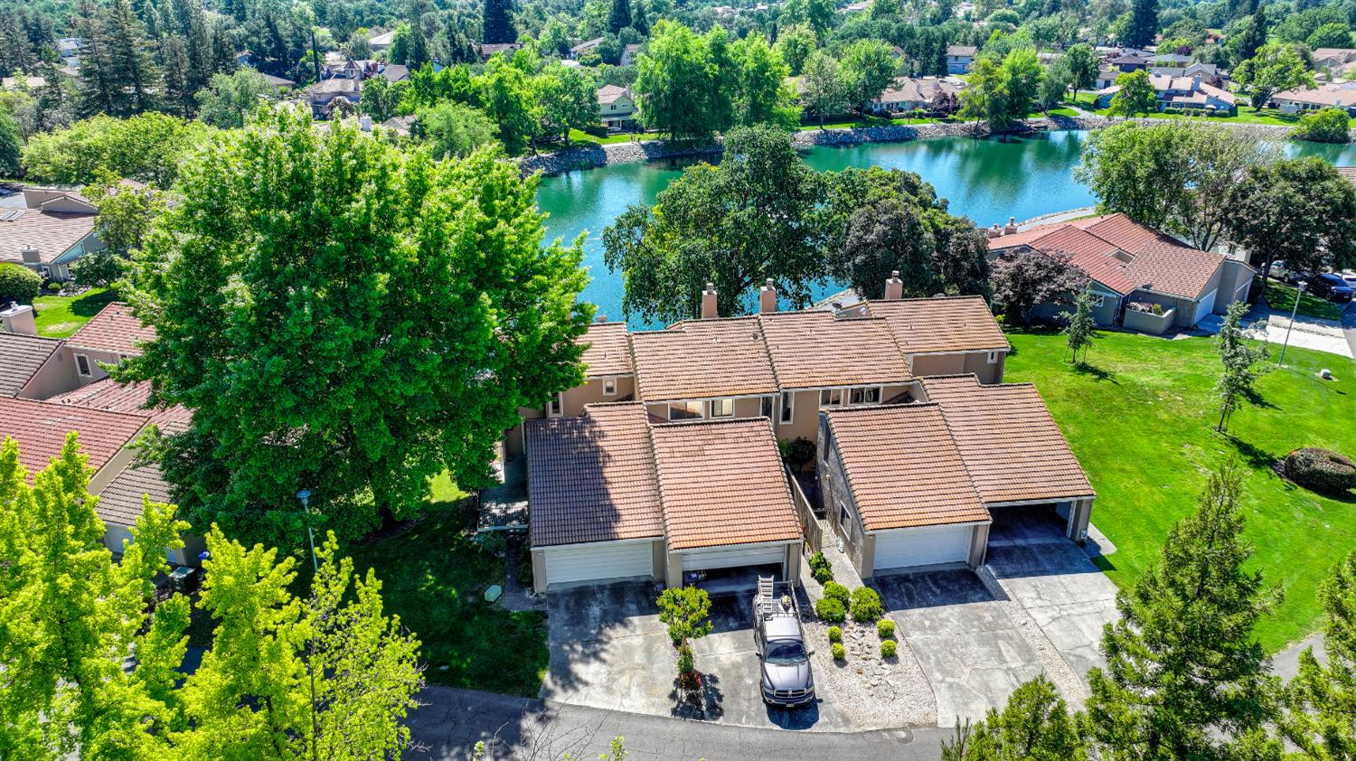 6986 Carreta Lane Rancho Murieta, CA 95683 - Photo 46 of 47 an aerial view of a house with garden space and lake view