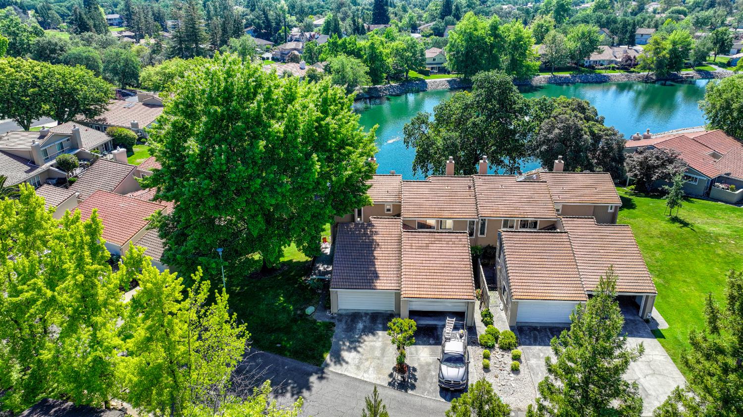 6986 Carreta Lane Rancho Murieta, CA 95683 - Photo 47 of 47 an aerial view of a house with a yard and lake view