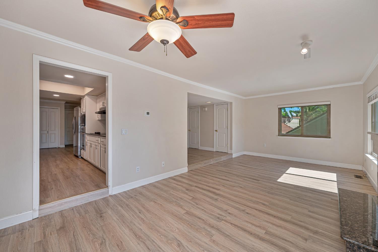 6986 Carreta Lane Rancho Murieta, CA 95683 - Photo 10 of 47 wooden floor in an empty room with a window
