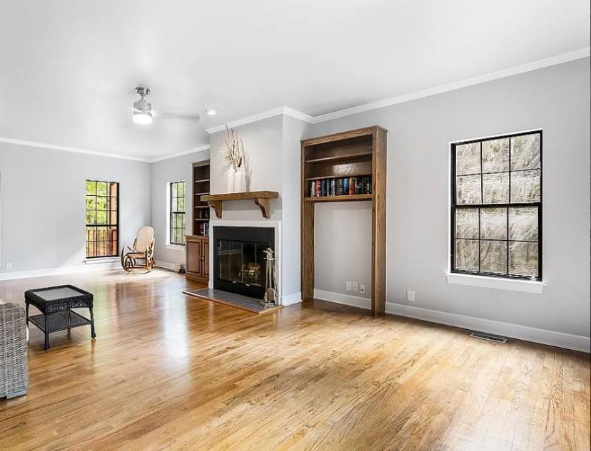 1525 Black Island Road Darien, GA 31305 - Photo 13 of 41 an empty room with furniture and a fireplace