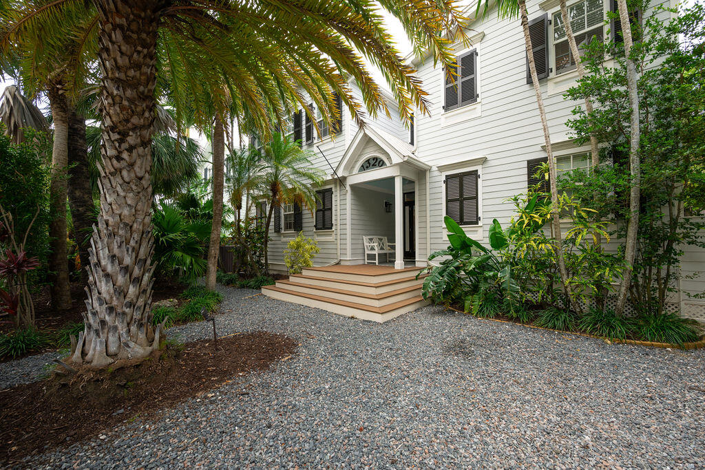 1320 South Street Key West, FL 33040 - Photo 1 of 36 a front view of a house with a garden