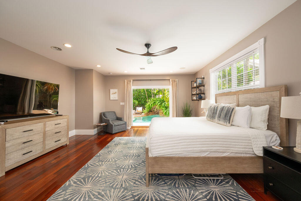 1320 South Street Key West, FL 33040 - Photo 15 of 36 a bedroom with a bed and a flat screen tv