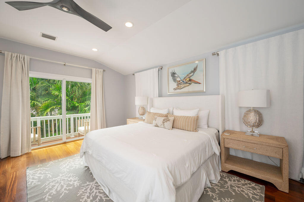 1320 South Street Key West, FL 33040 - Photo 18 of 36 a bedroom with a large bed and a window