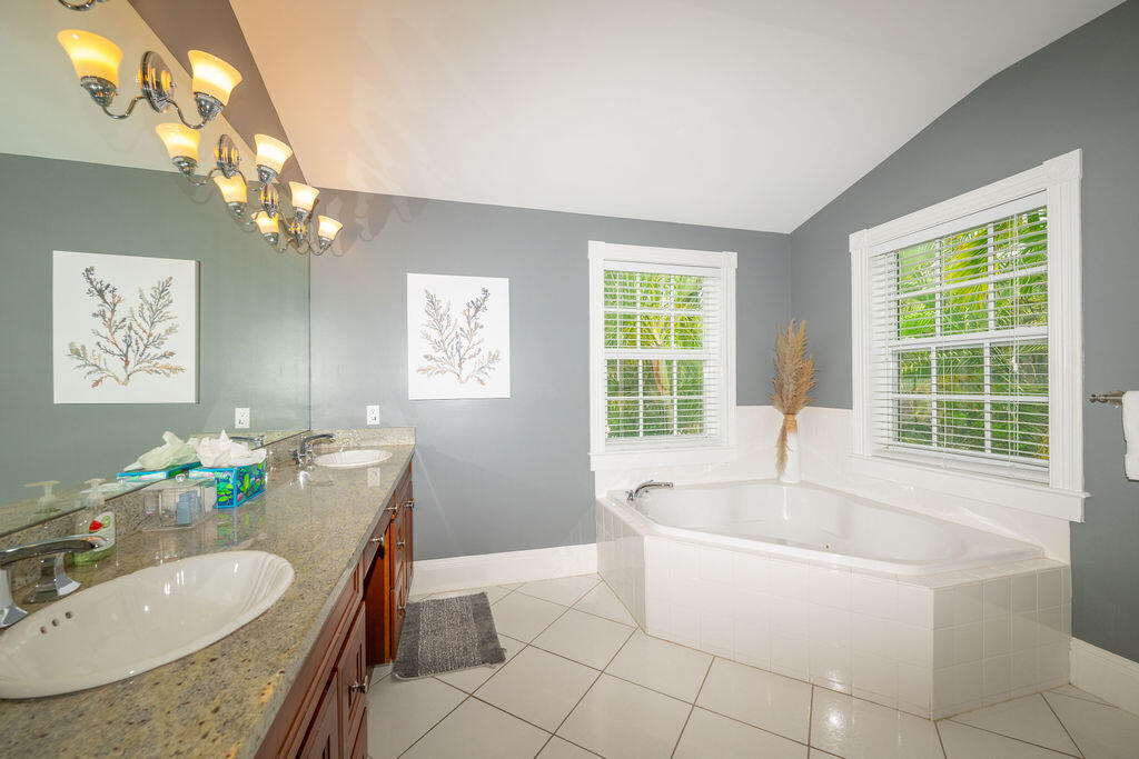 1320 South Street Key West, FL 33040 - Photo 19 of 36 a bath tub sitting in a bathroom next to a bathroom