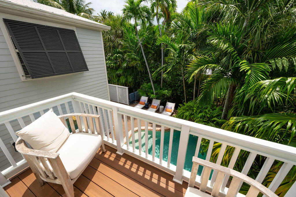 1320 South Street Key West, FL 33040 - Photo 22 of 36 a view of a chair in wooden deck