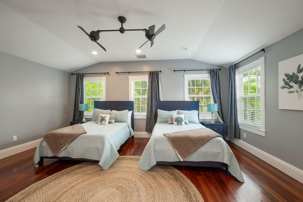 1320 South Street Key West, FL 33040 - Photo 28 of 36 a bedroom with a large bed and a large window