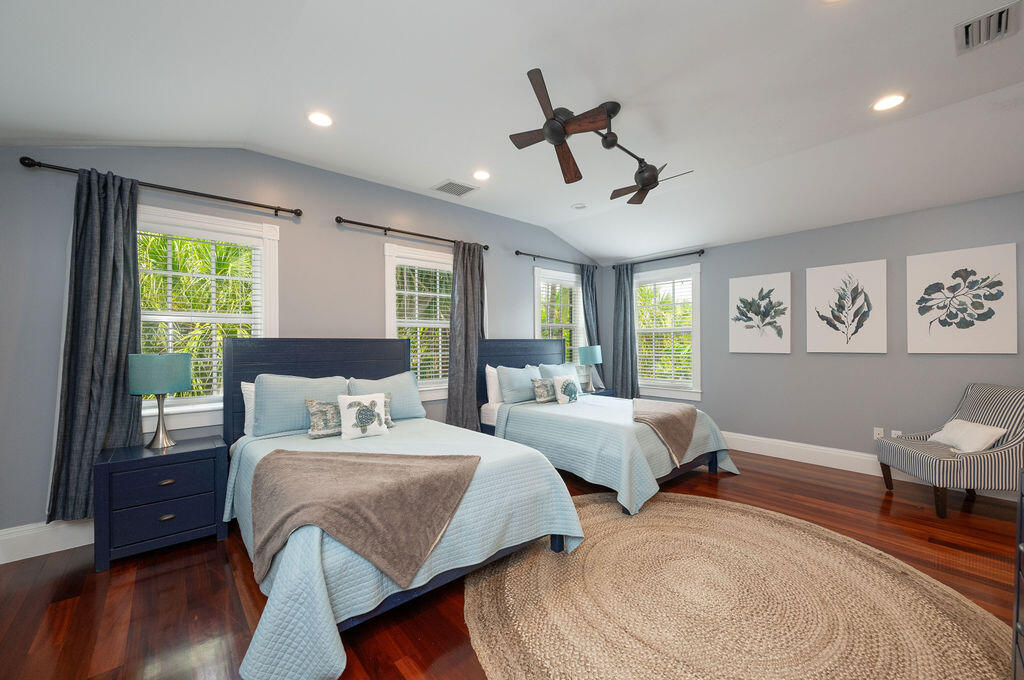 1320 South Street Key West, FL 33040 - Photo 29 of 36 a bedroom with two beds and a large window