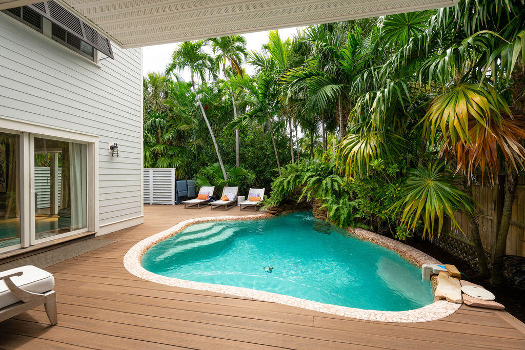 1320 South Street Key West, FL 33040 - Photo 31 of 36 a view of a swimming pool with a patio