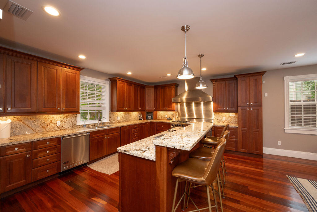 1320 South Street Key West, FL 33040 - Photo 6 of 36 a large kitchen with lots of counter space a sink and dining table