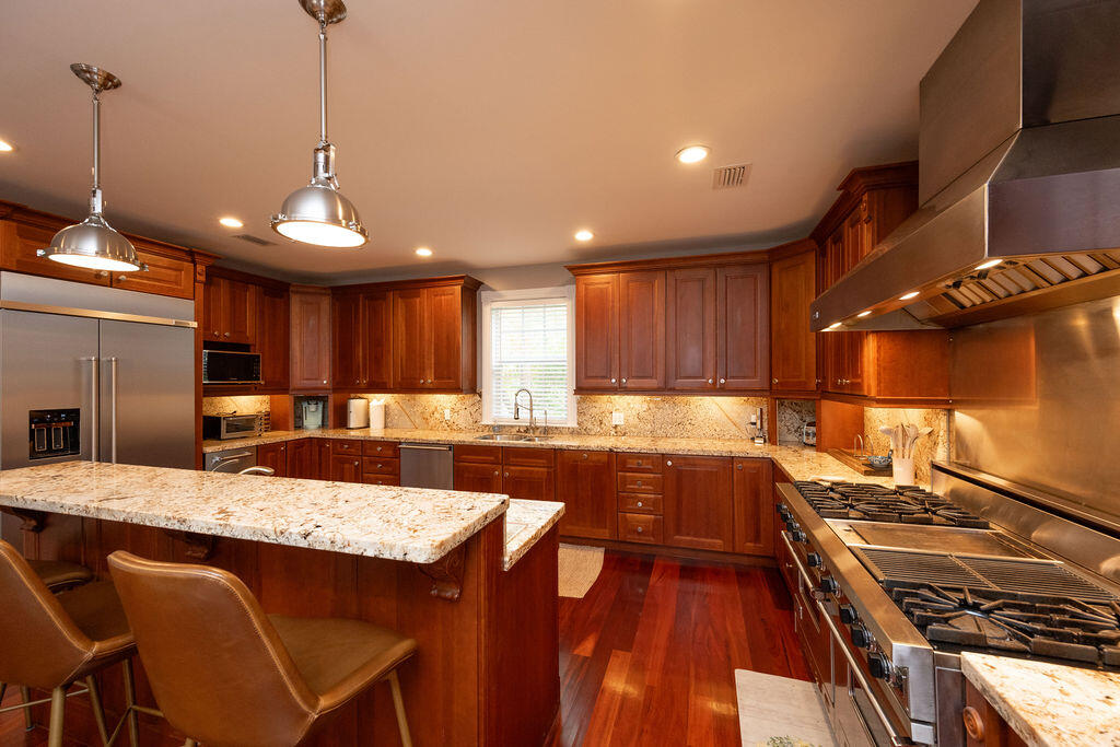 1320 South Street Key West, FL 33040 - Photo 8 of 36 a kitchen with a stove a refrigerator and a sink