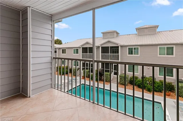 a view of a brick house with a large window