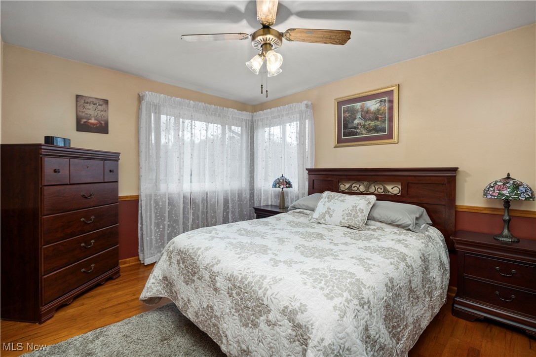 20114 Drake Road Strongsville, OH 44149 - Photo 15 of 35 Bedroom with dark wood-type flooring and a ceiling fan