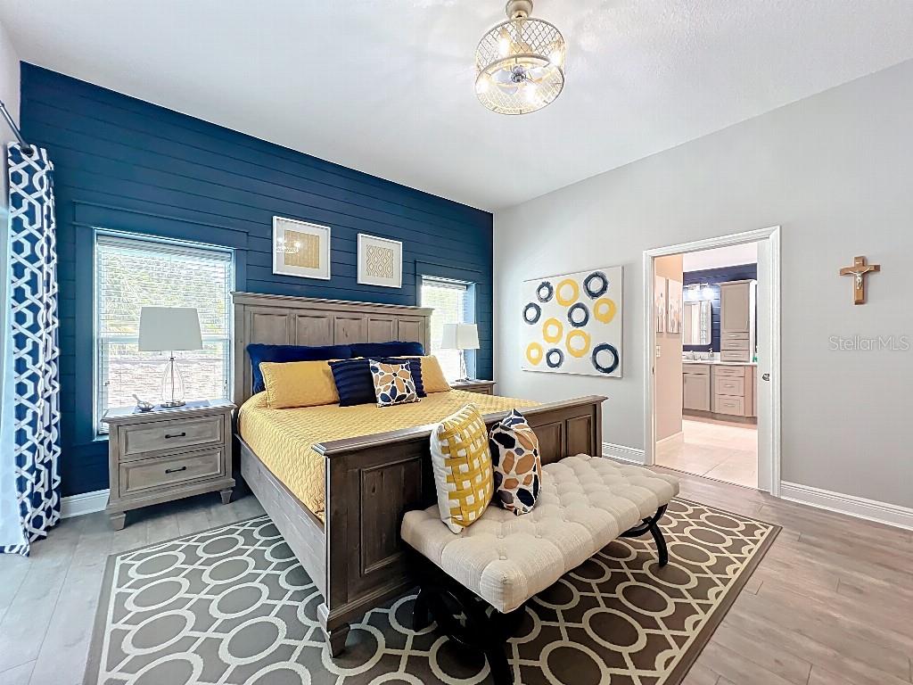 3191 Warbler Loop The Villages, FL 32163 - Photo 18 of 42 a bed room with a bed and a table