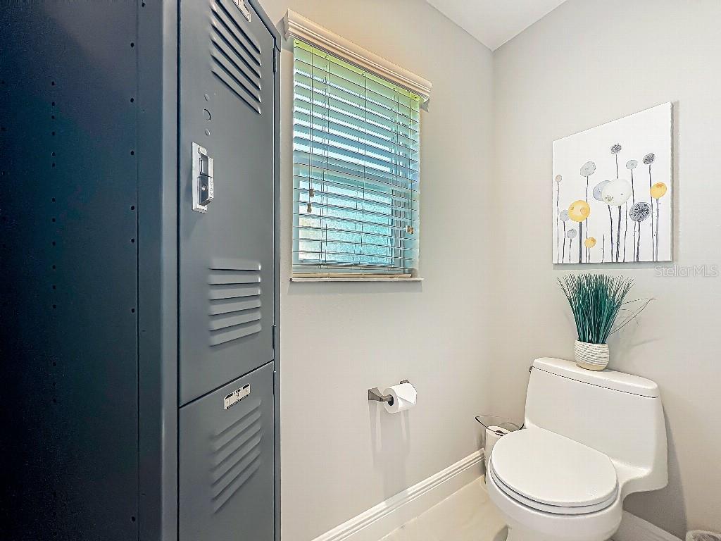 3191 Warbler Loop The Villages, FL 32163 - Photo 21 of 42 a white toilet sitting next to a bathroom sink